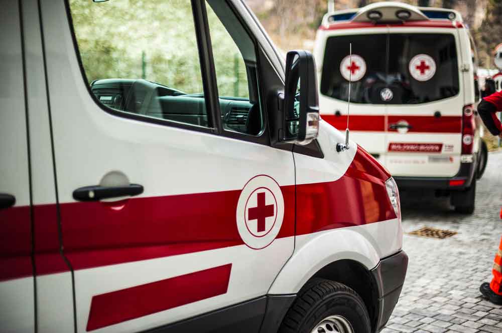 Two Ambulance Service Vehicles