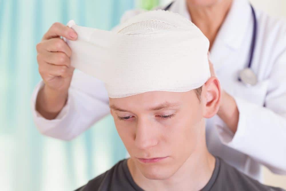 Young Man With Bandage On His Head